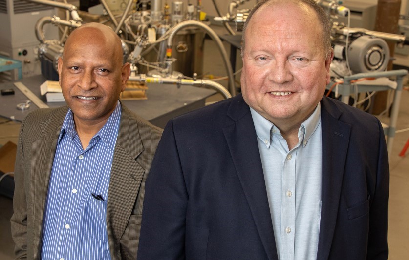 From left, Center for Advanced Power Systems Associate Director Sastry Pamidi and Director Roger McGinnis in a lab at the CAPS facility. (Bruce Palmer/FSU Photography Services)